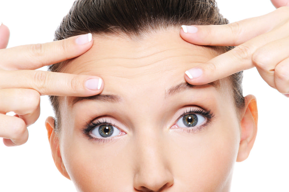 Rostro femenino arrugas frente Botox